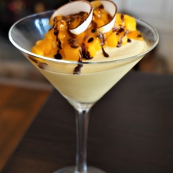 Mango and Passionfruit Fool with coconut shavings